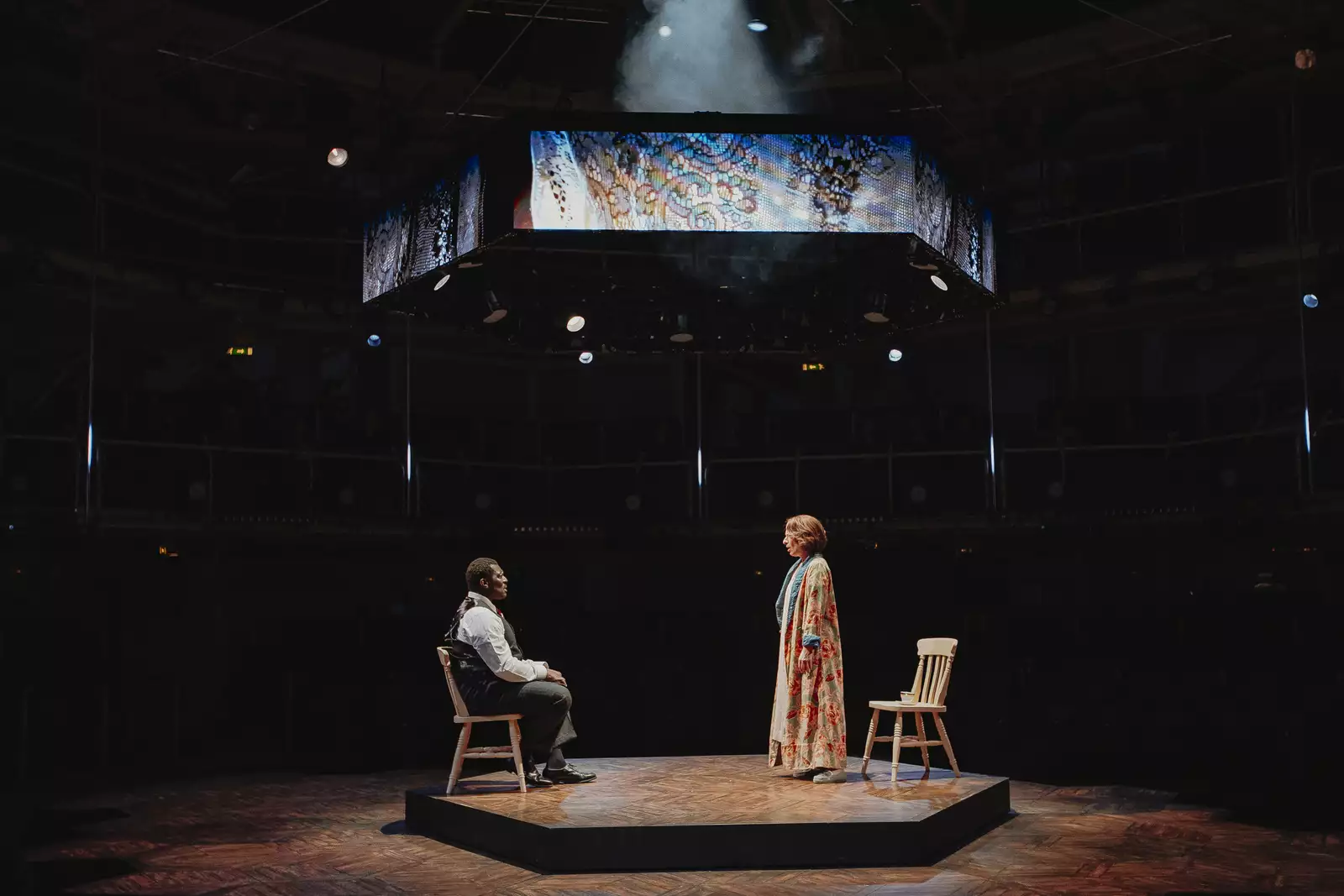 Two people stood on stage performing during Liberation at the Royal Exchange