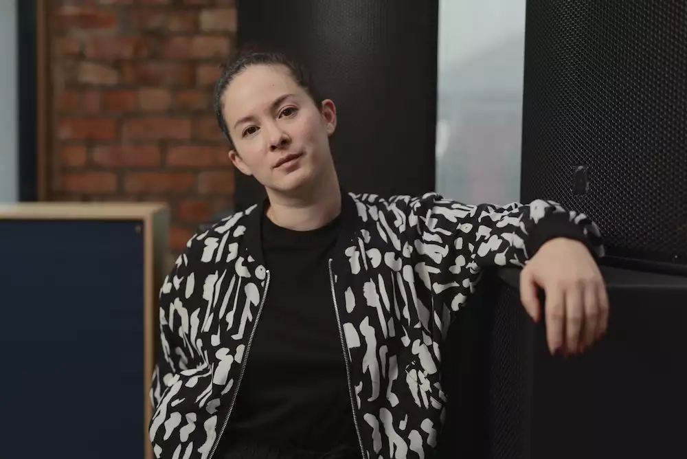Jasmin Kent Rodgman wearing a black and white striped top