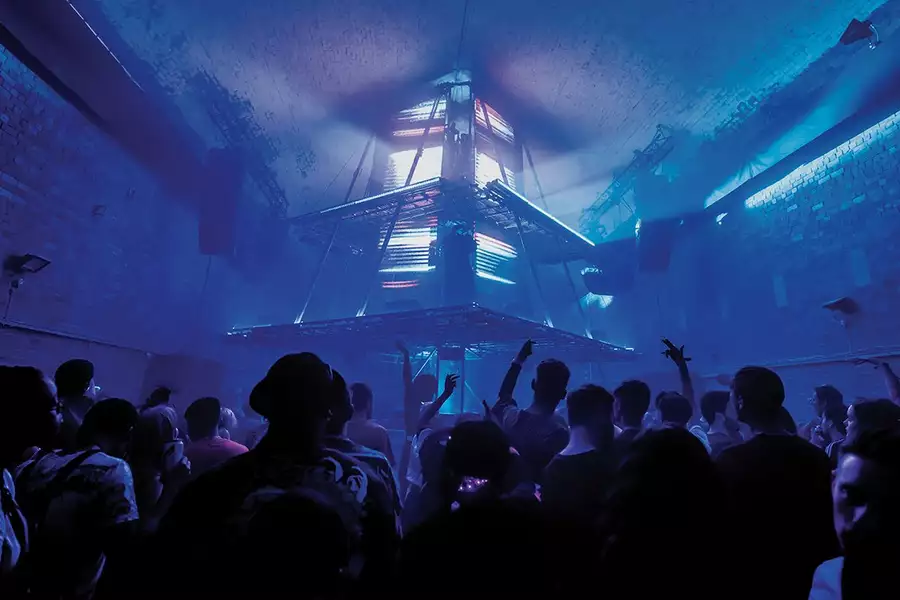 Skepta on stage with blue lighting