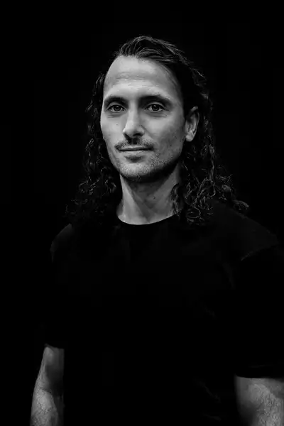 Black and white headshot of Blenard Azizaj