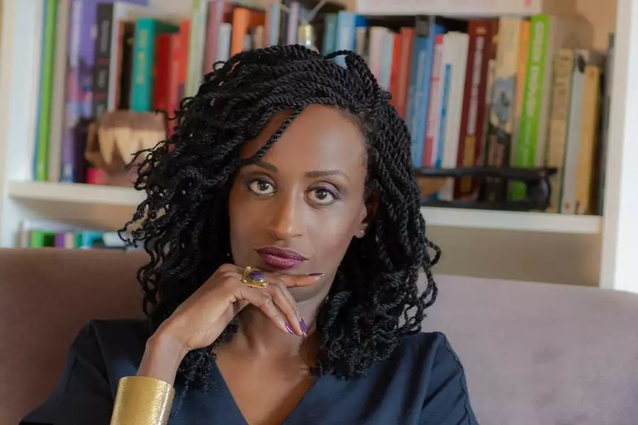 Photo of Dr Leyla Hussein in front of a bookcase