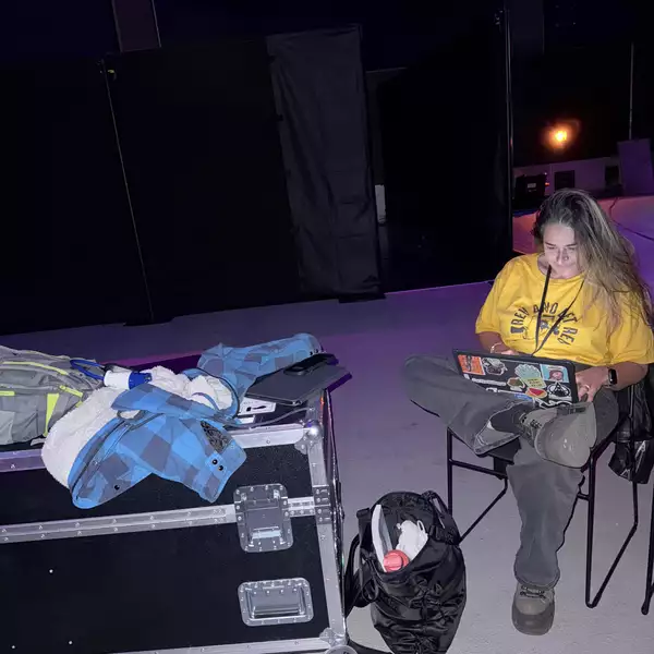 afshan d’souza-lodhi sat on a laptop working in the Warehouse