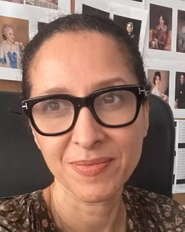 Headshot of Lisa Duncan wearing a brown patterned top