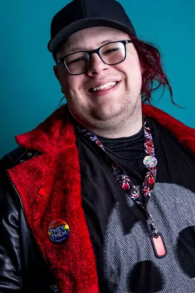 Finch Murphy headshot smiling on a blue background