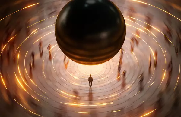 A lone figure stands beneath a massive black sphere, surrounded by swirling golden light trails