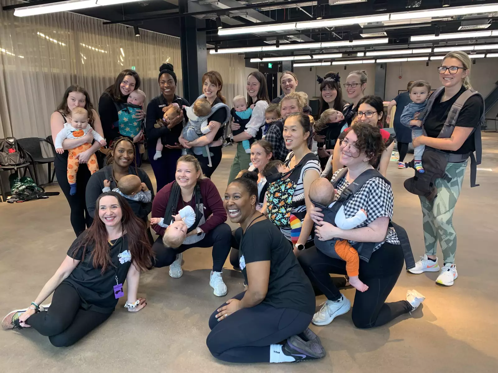 First breath families smiling for a group photo
