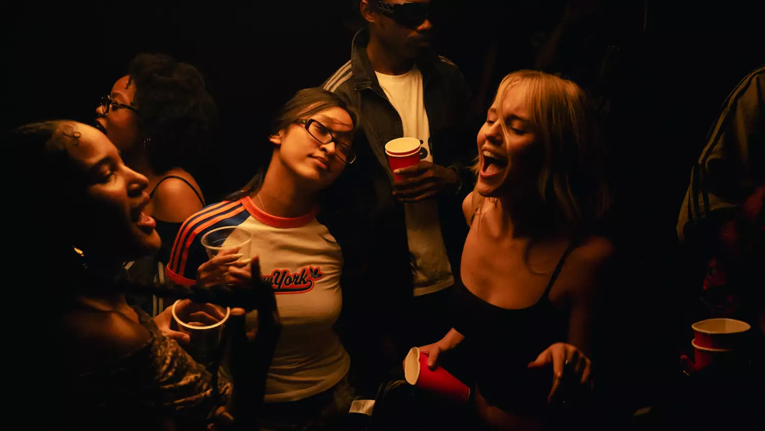 A group of people dancing in a club