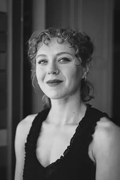 Black and white headshot of Clara Scudder-Davis