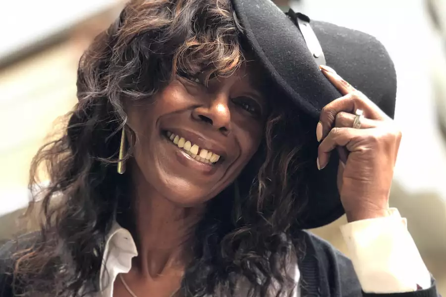 Audrey Hall smiling wearing a black hat