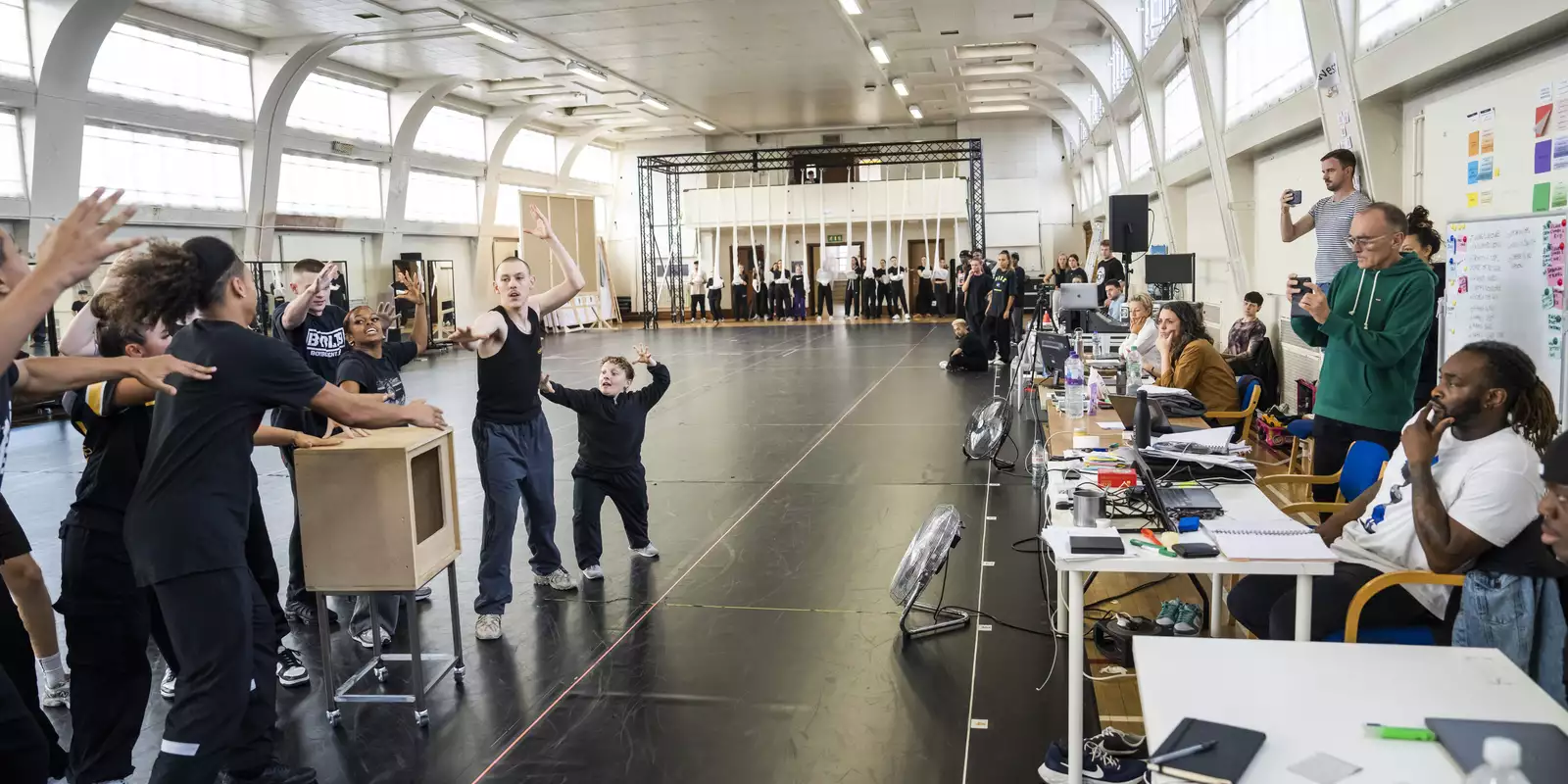 The rehearsal room for Free Your Mind with the creative team watching the dancers