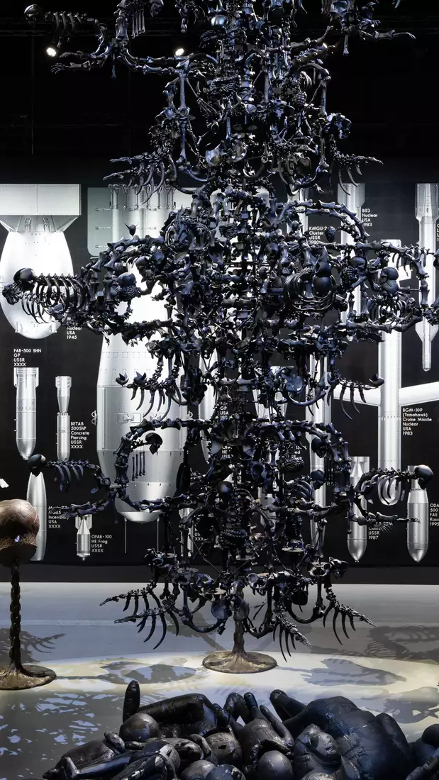 A view of La Commedia Umana – a giant, black chandelier – in the exhibition