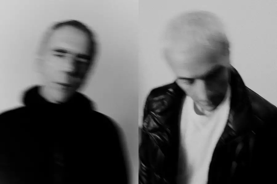 A black and white photograph of Karl Hyde and Rick Smith of electronic music group Underworld
