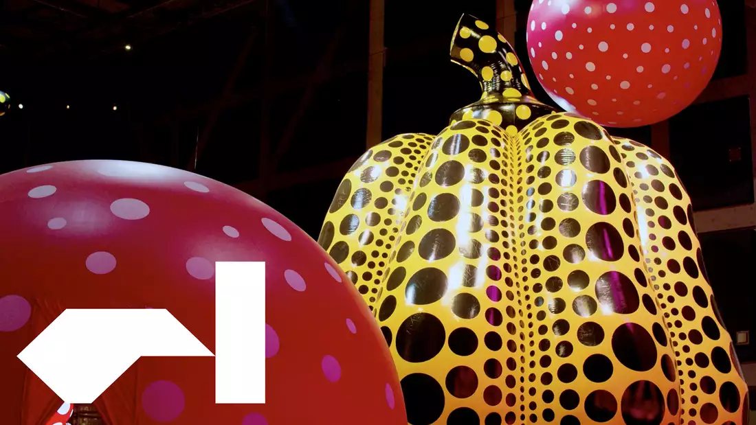 A still of a black and yellow pumpkin made by the artist Yayoi Kusama