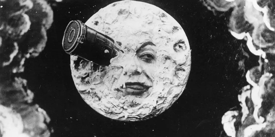 A still from the film Le Voyage Dans La Lune which shows a rocket crashing into the moon