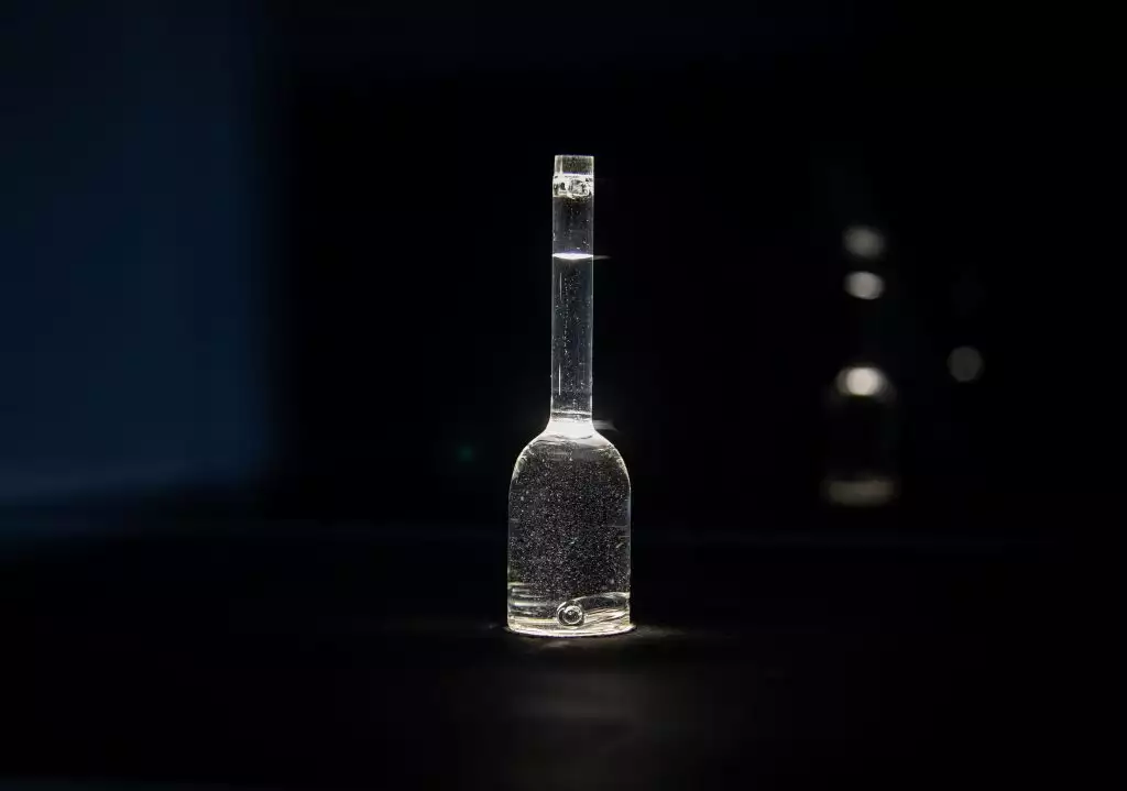 An artwork of a glass bottle filled with bubbling water