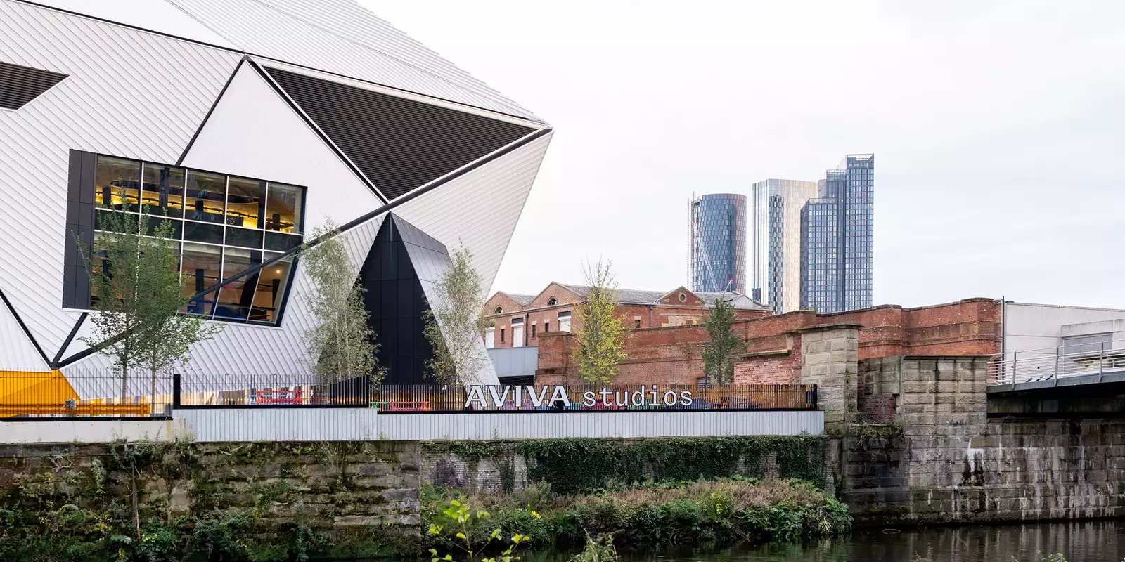 Photo of the exterior of Aviva Studios from across the river