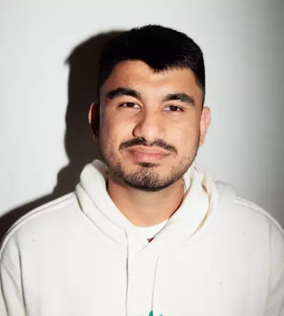 Sujanhariharan Ragunathan wearing an off-white Adidas hoodie on a white background