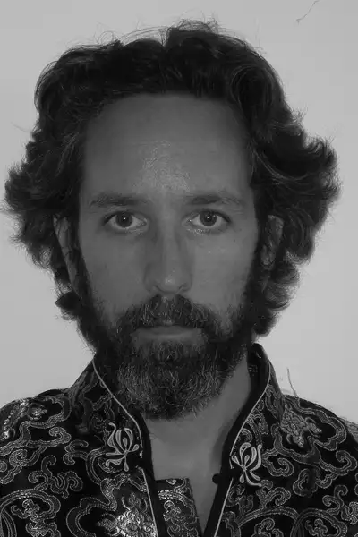 Black and white headshot of Guy Hoare