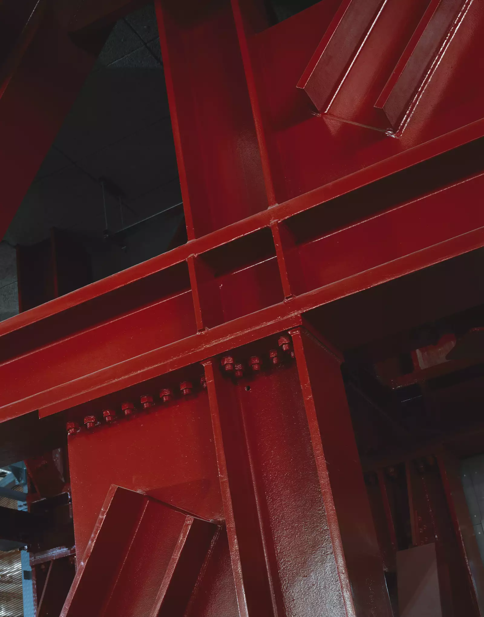 Photograph by Hélène Binet showing red metalwork during the construction of Aviva Studios