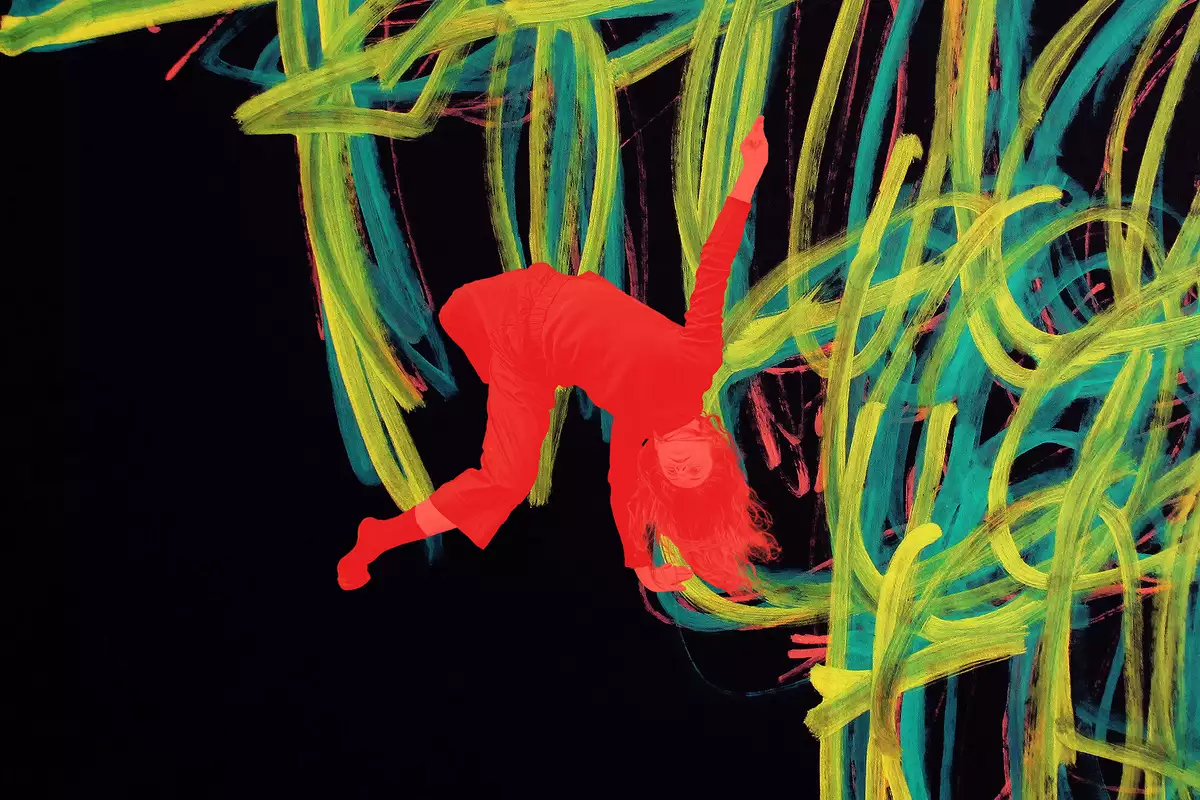A painting by Michael Beard showing yellow, red and blue lines on a black background. There is a red image of a dancer upside down overlayed on the painting.