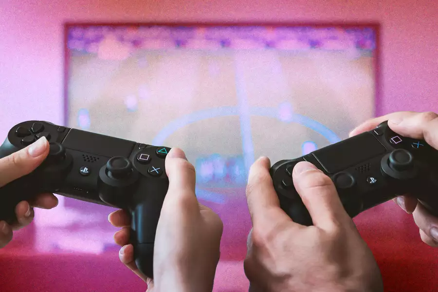 Two consoles in front of a glittery pink screen