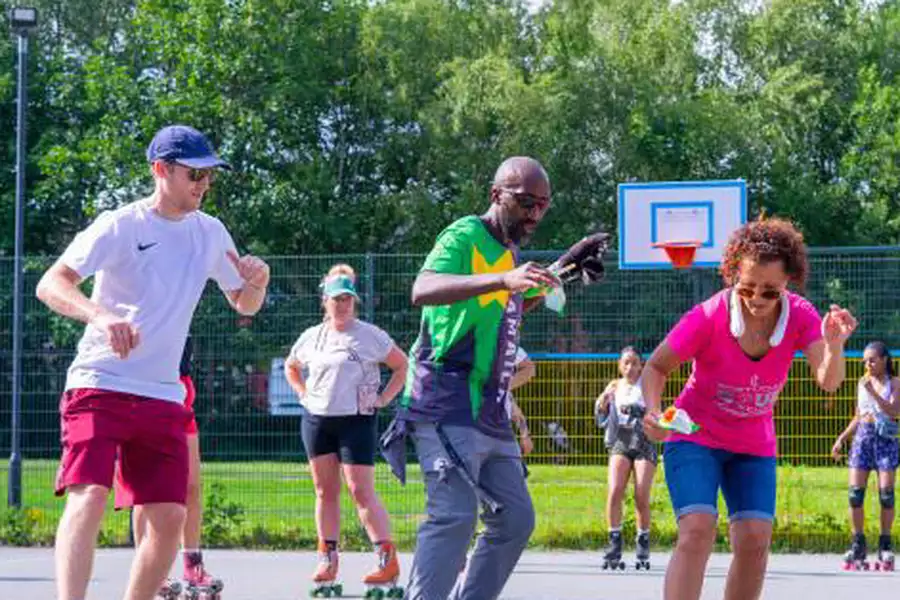 Three people on roller-skates outside