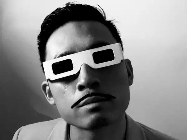 A black and white photograph of Factory Sounds 2023 cohort member STNLY wearing 3D glasses and a fake moustache
