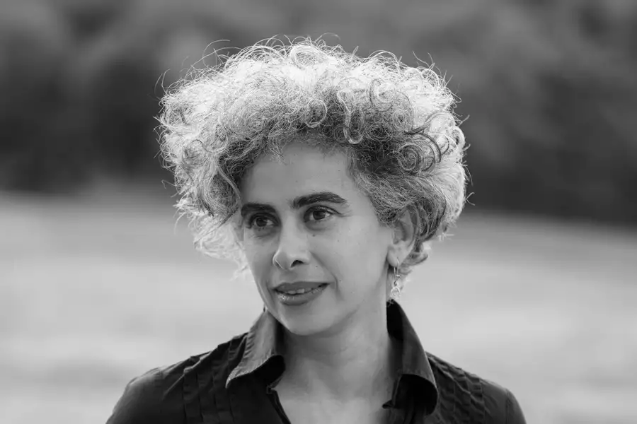 Black and white headshot of Adania Shibli smiling