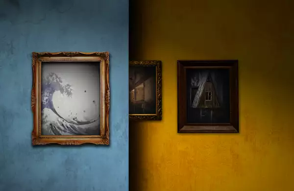 The image is divided into two contrasting halves: the left side has a blue wall with a framed artwork of a stylised wave, while the right side features a yellow wall with framed pictures, including one of an abandoned house.