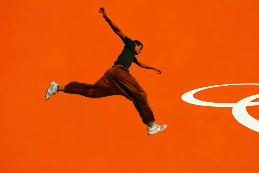 A person jumping on a bright orange background