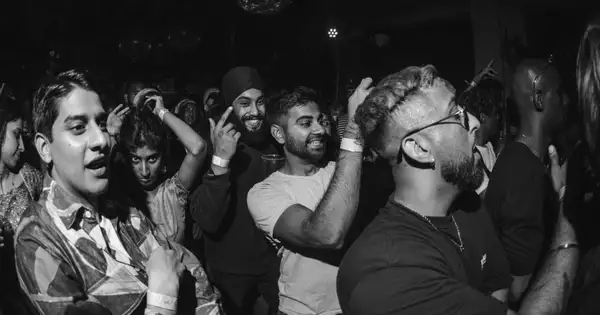 Black and White photo of group of people at a concert event