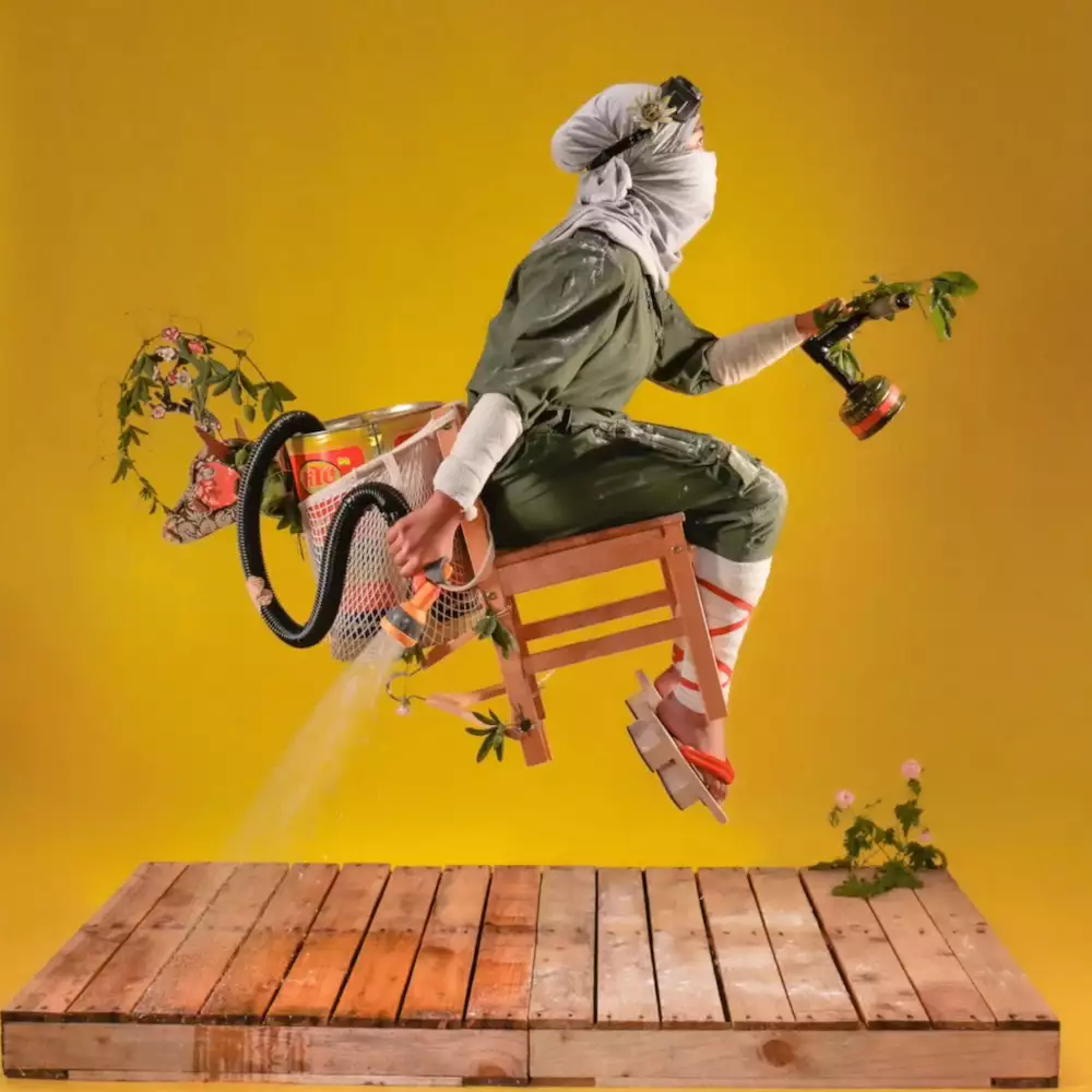 Photograph by Benji Reid of a figure suspended in the air on a chair. They are surrounded by surreal objects. The background is yellow.