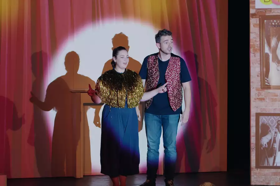 Photo of two people on stage