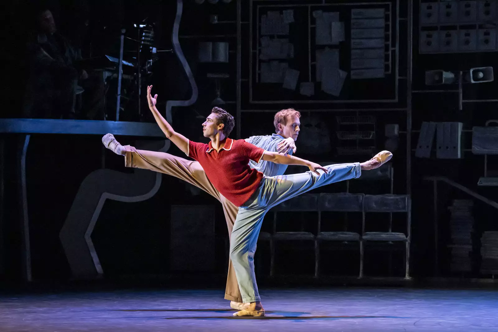 A photo of two ballerinas doing arabesques